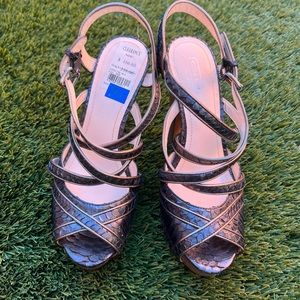 GORGEOUS HOLIDAY HEELS!NWT COACH pewter and gold toner Coach heels. Size 7.5